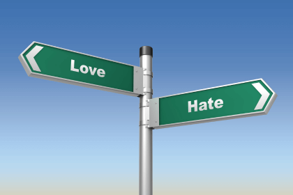 love and hate signs pointing in opposite directions